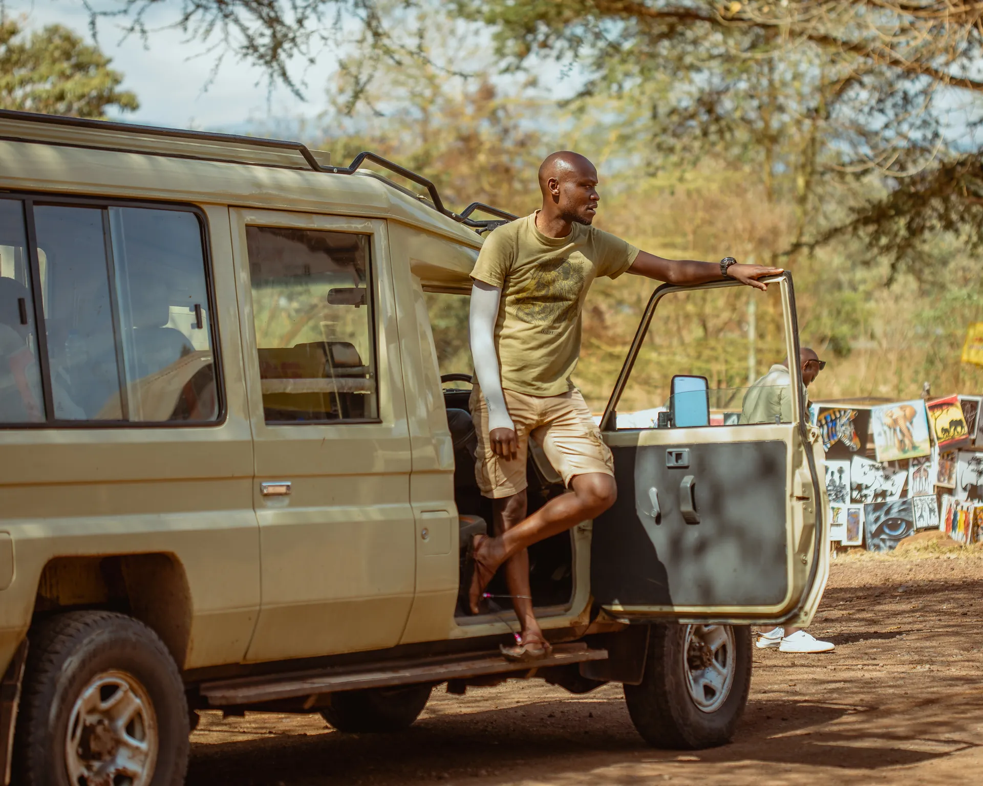 Safari vehicle travelling through a Tanzania wildlife area
